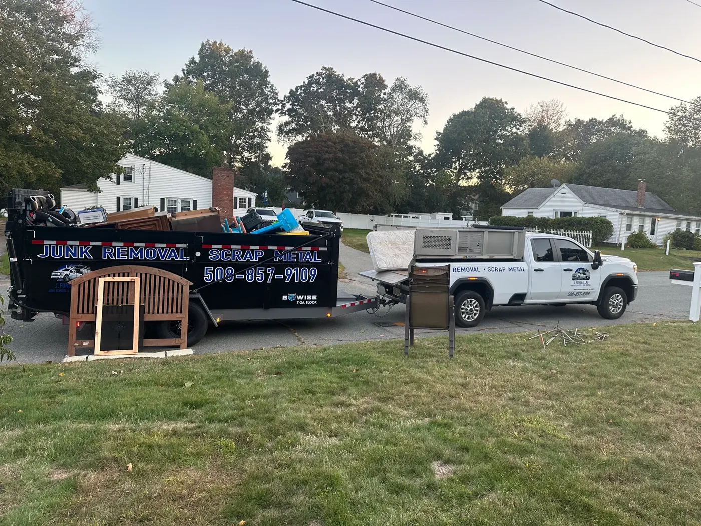 JF Property Services truck and dumpster on a residential cleanup job